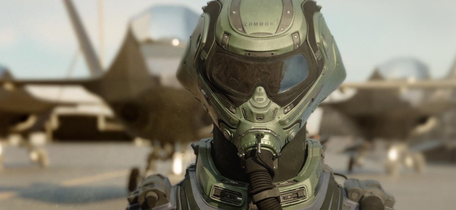 Close-up of a futuristic soldier in a green exoskeleton suit, with a blurred spacecraft in the background.