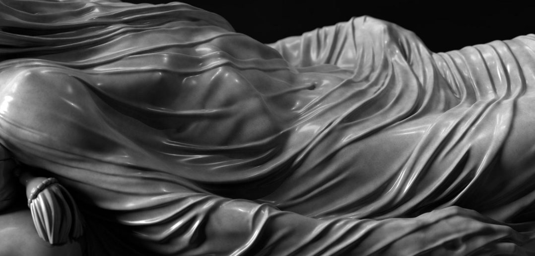 Close-up of a 3D sculpted figure with flowing, draped fabric.