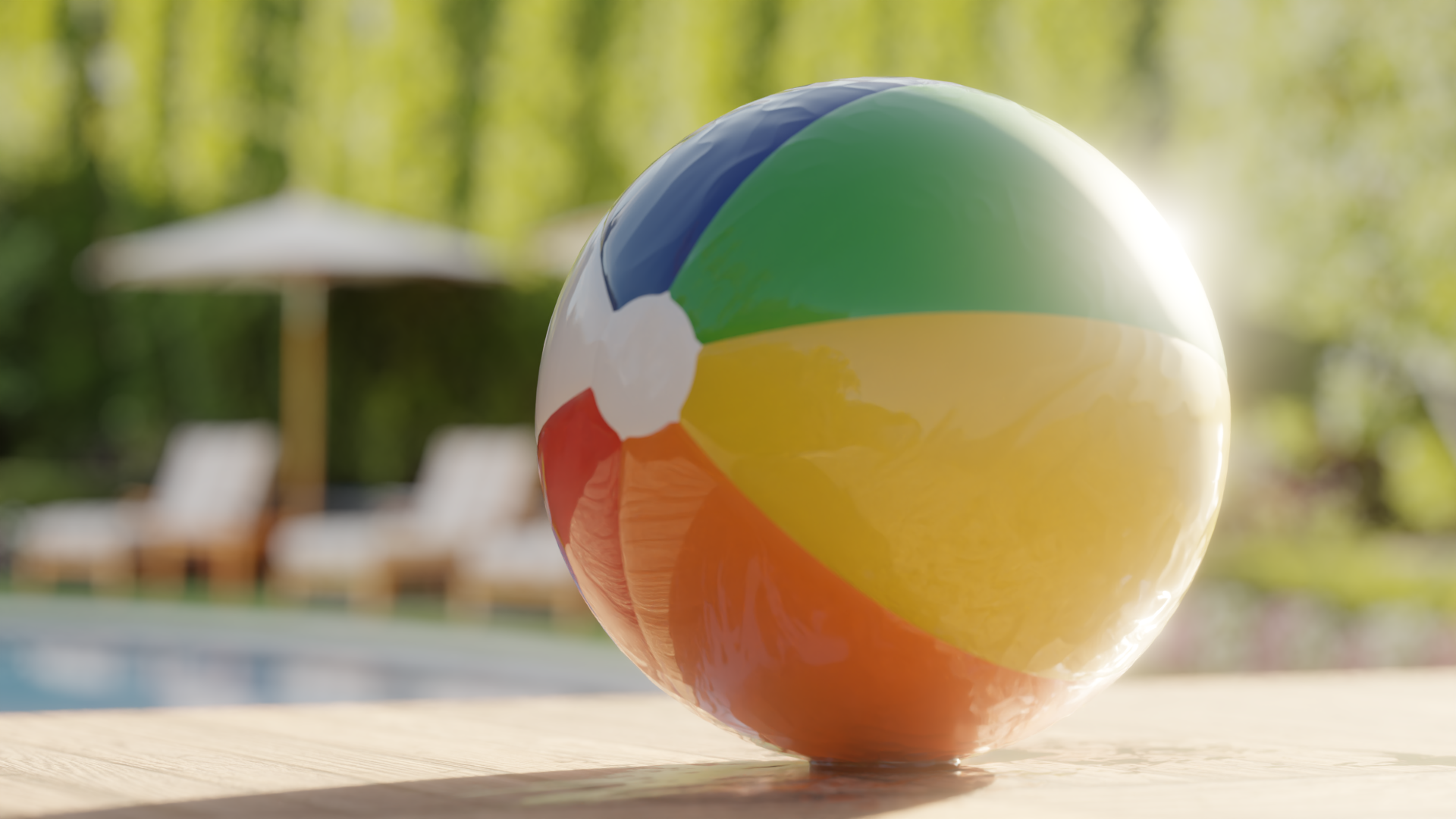 Colorful beach ball near poolside with loungers and umbrella.
