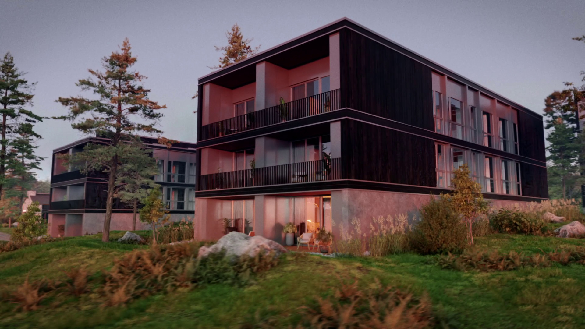 Modern multi-story building with dark wooden panels and balconies, surrounded by greenery and trees.