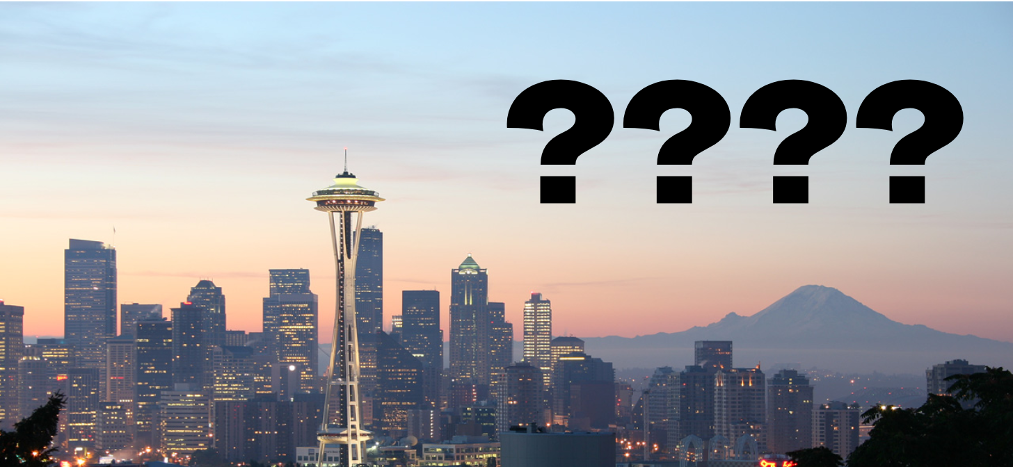City skyline with Space Needle, question marks overlay