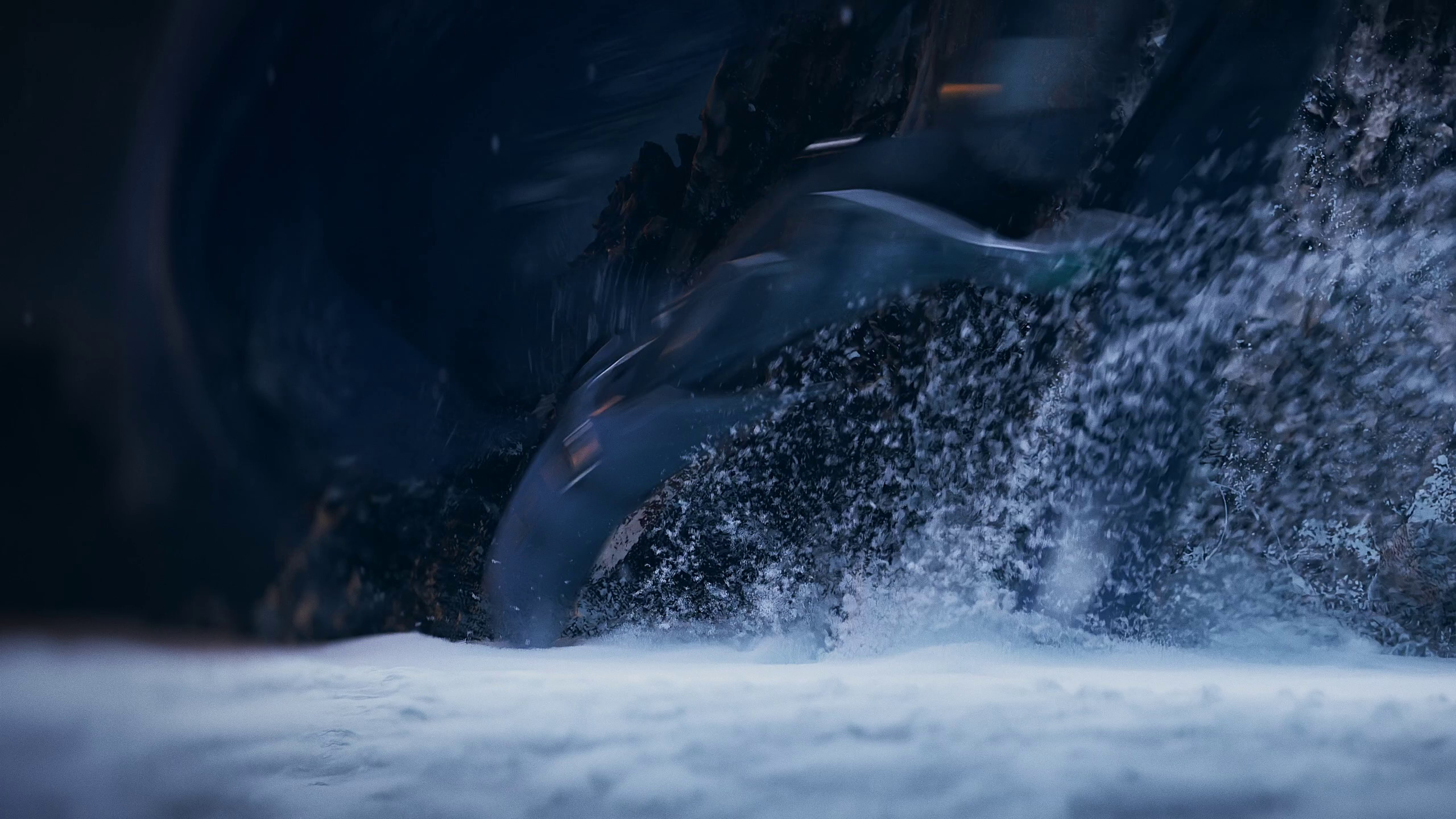 Close-up of a futuristic, sleek vehicle's wheel, partially submerged in snow, with water splashing around it.