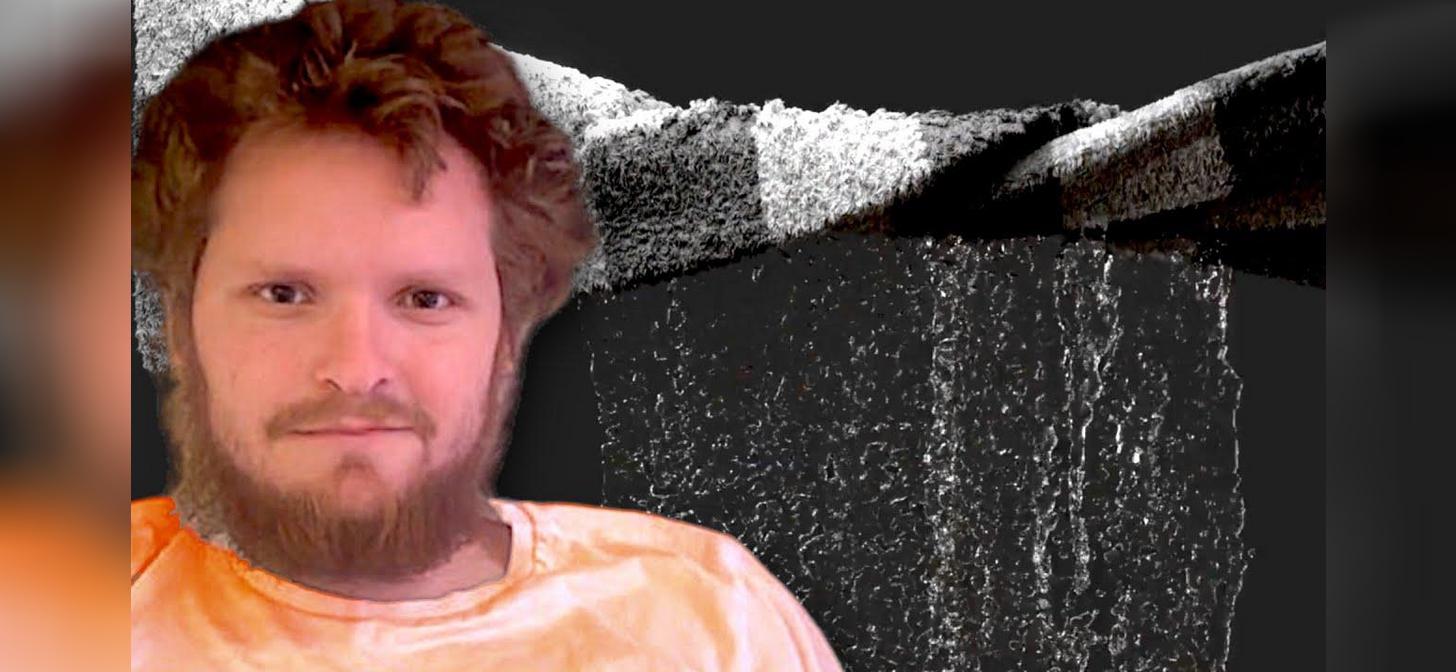 Man with beard and curly hair wearing an orange shirt and brown hat, with a digital waterfall in the background.